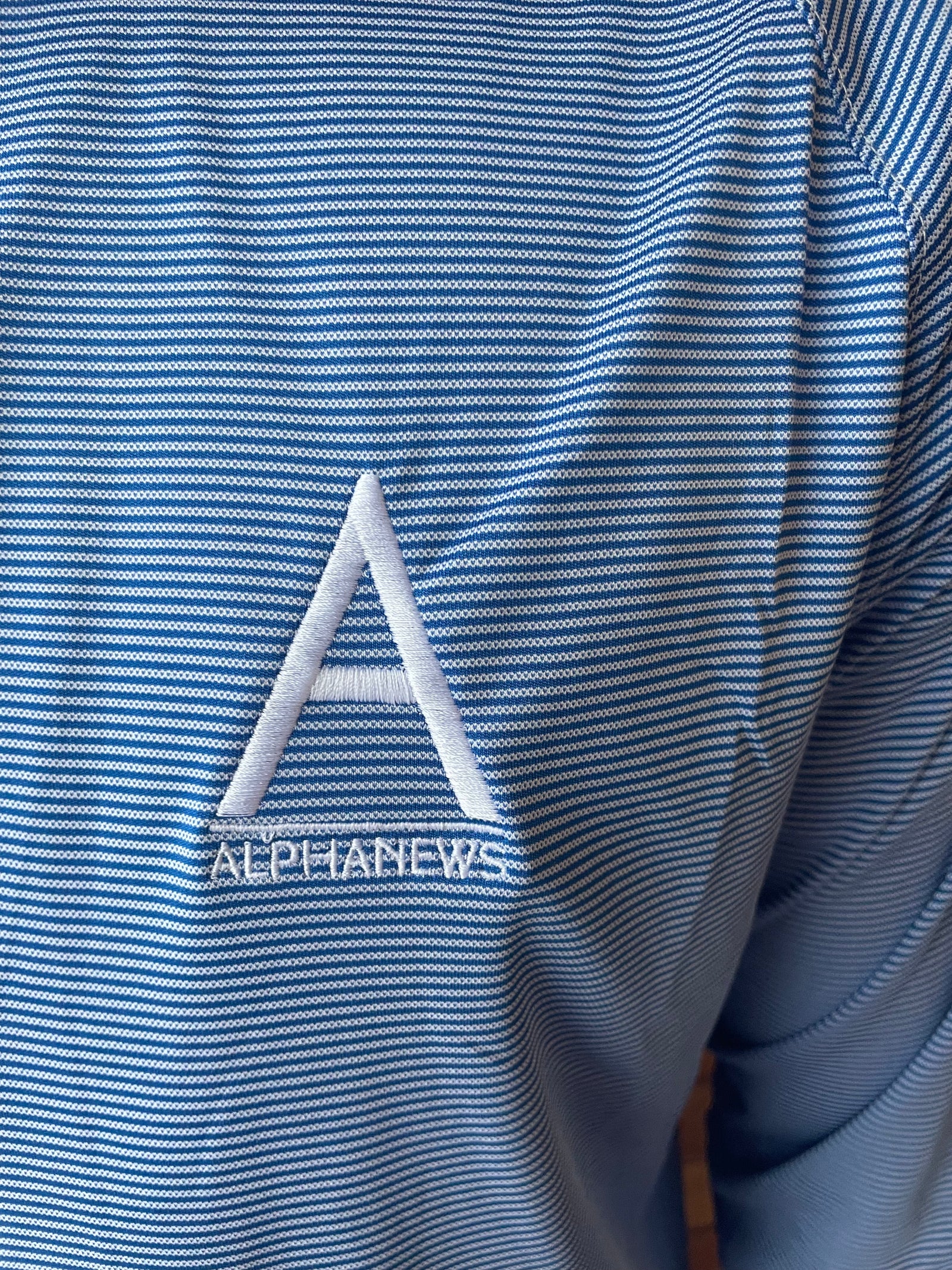 Alpha News quarter zip